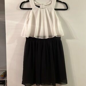 Tank dress with sheer overlay top.